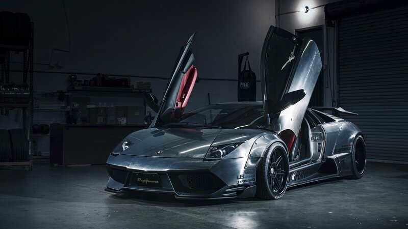 Silver Lamborghini with doors open