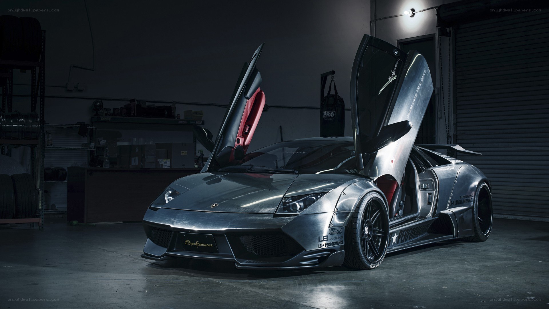 Silver Lamborghini with doors open