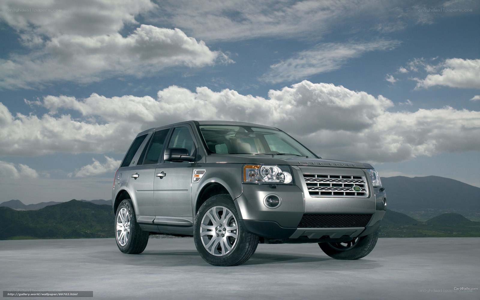 Silver Land Rover in scenic landscape