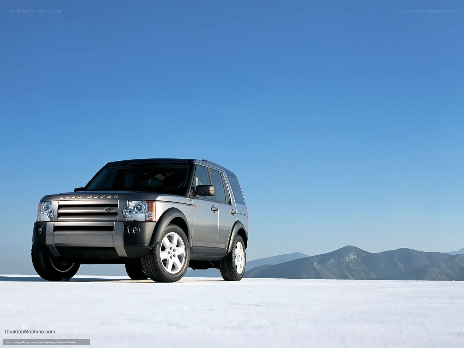 Silver Land Rover in snowy landscape