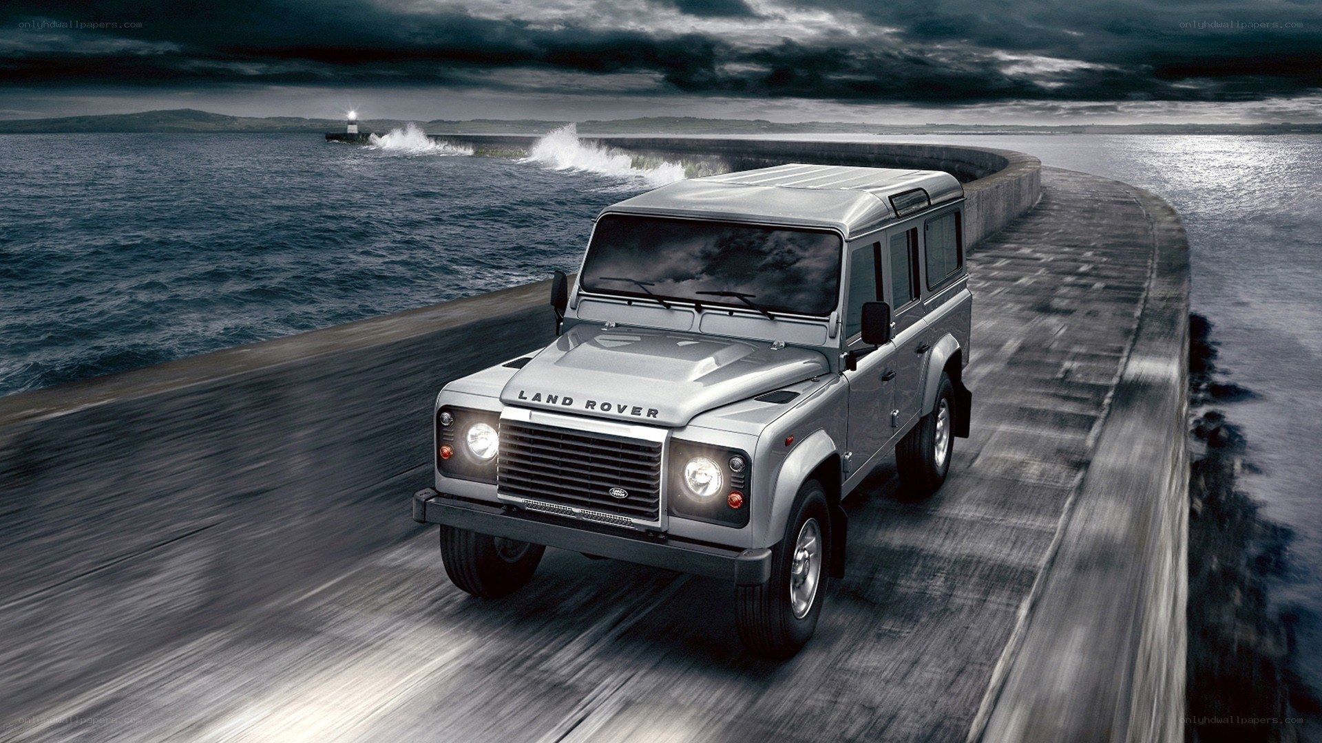 Silver Land Rover on a pier