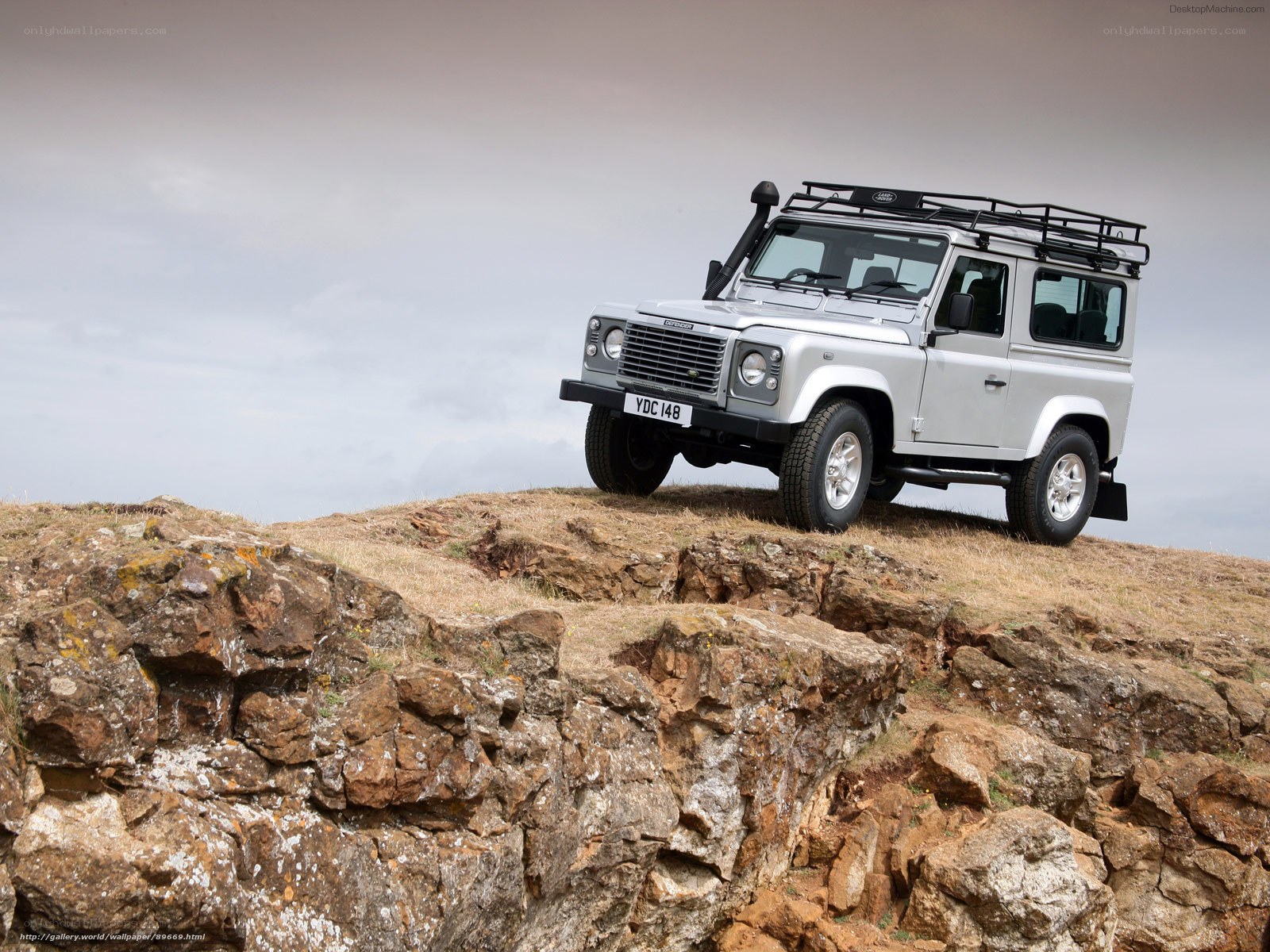 silver land rover on cliff