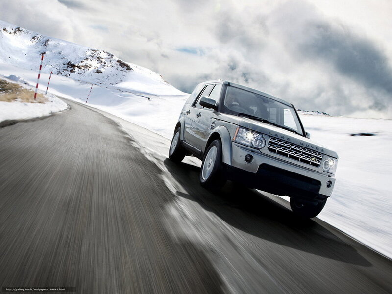 Silver Land Rover on snowy road