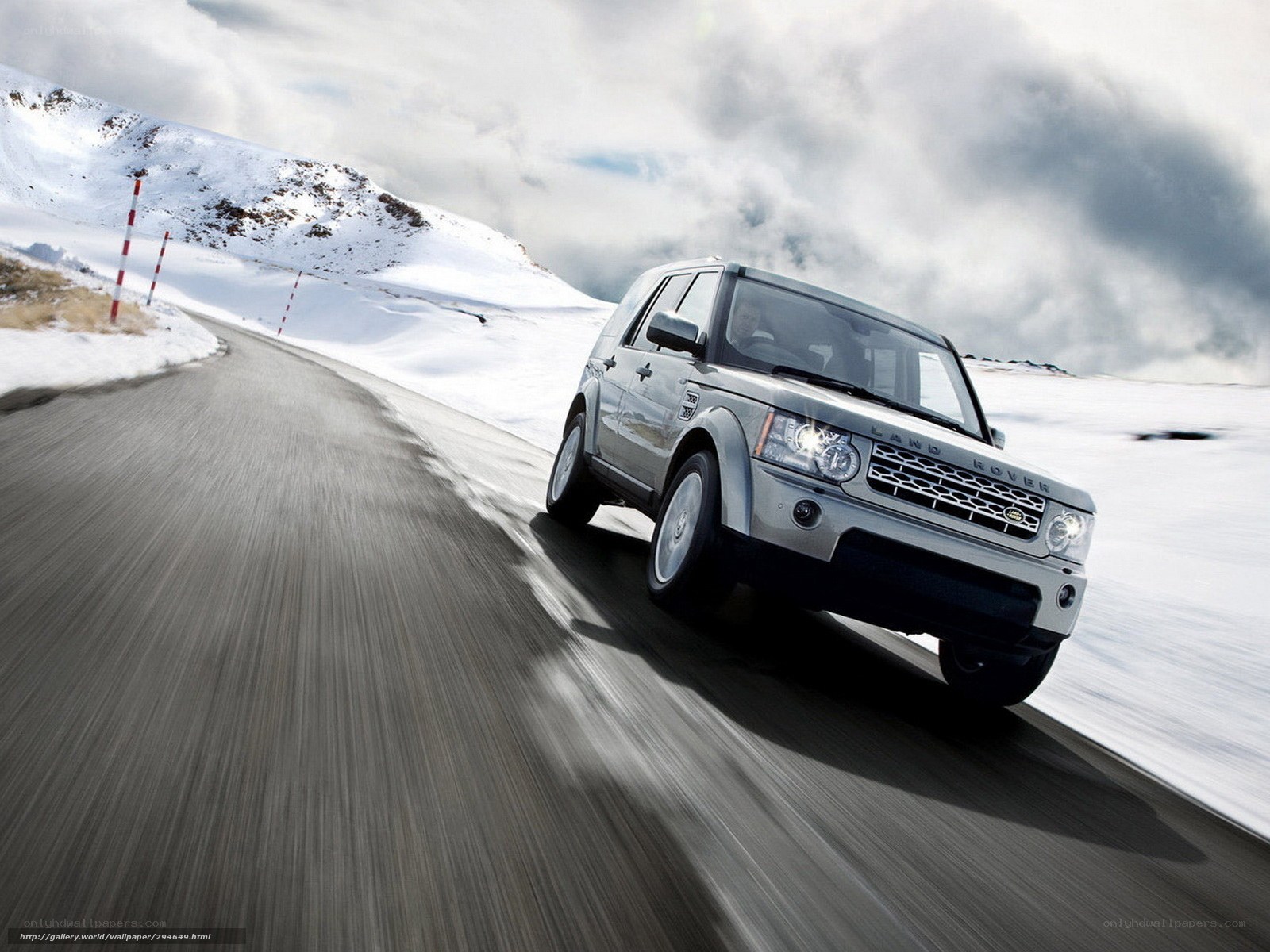 Silver Land Rover on snowy road