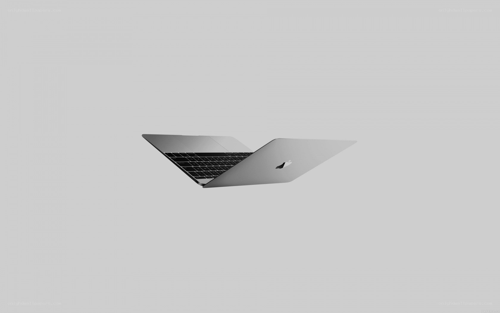 silver laptop on gray background