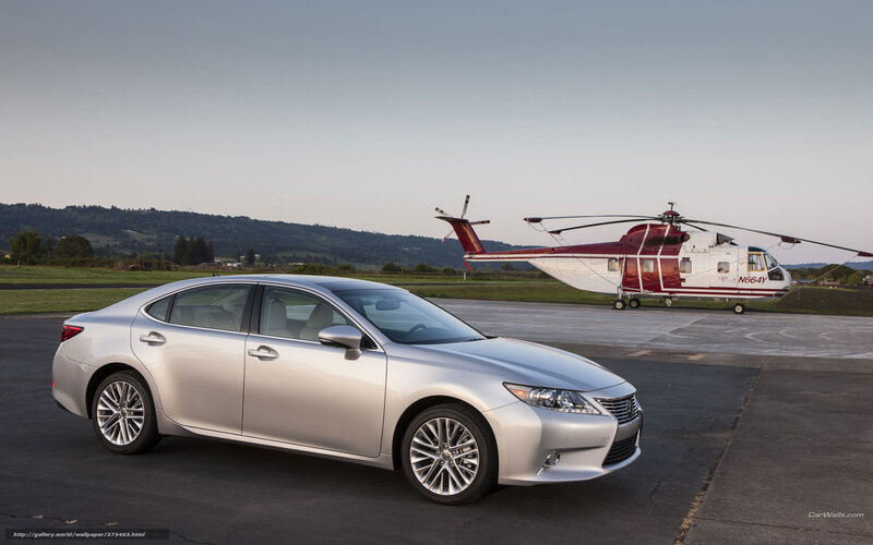 Silver Lexus and helicopter on tarmac