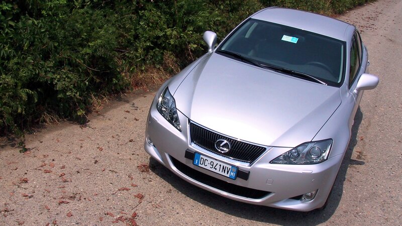 silver lexus car on gravel