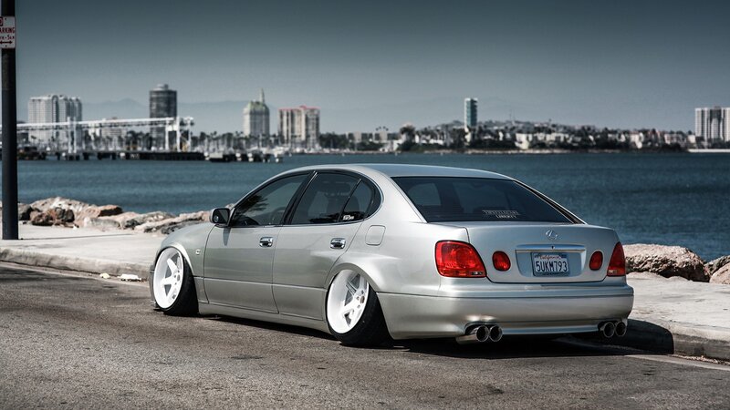 silver lexus coupe by the water