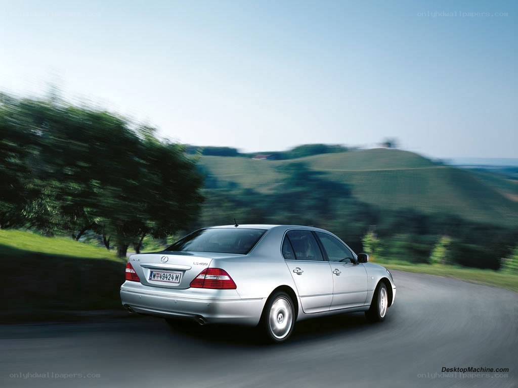 silver lexus driving on a road