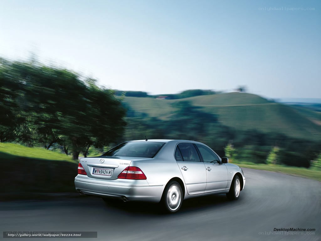 silver lexus driving on country road