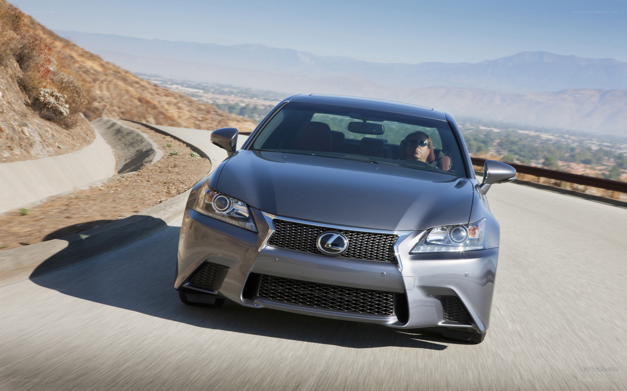 silver lexus driving on mountain road