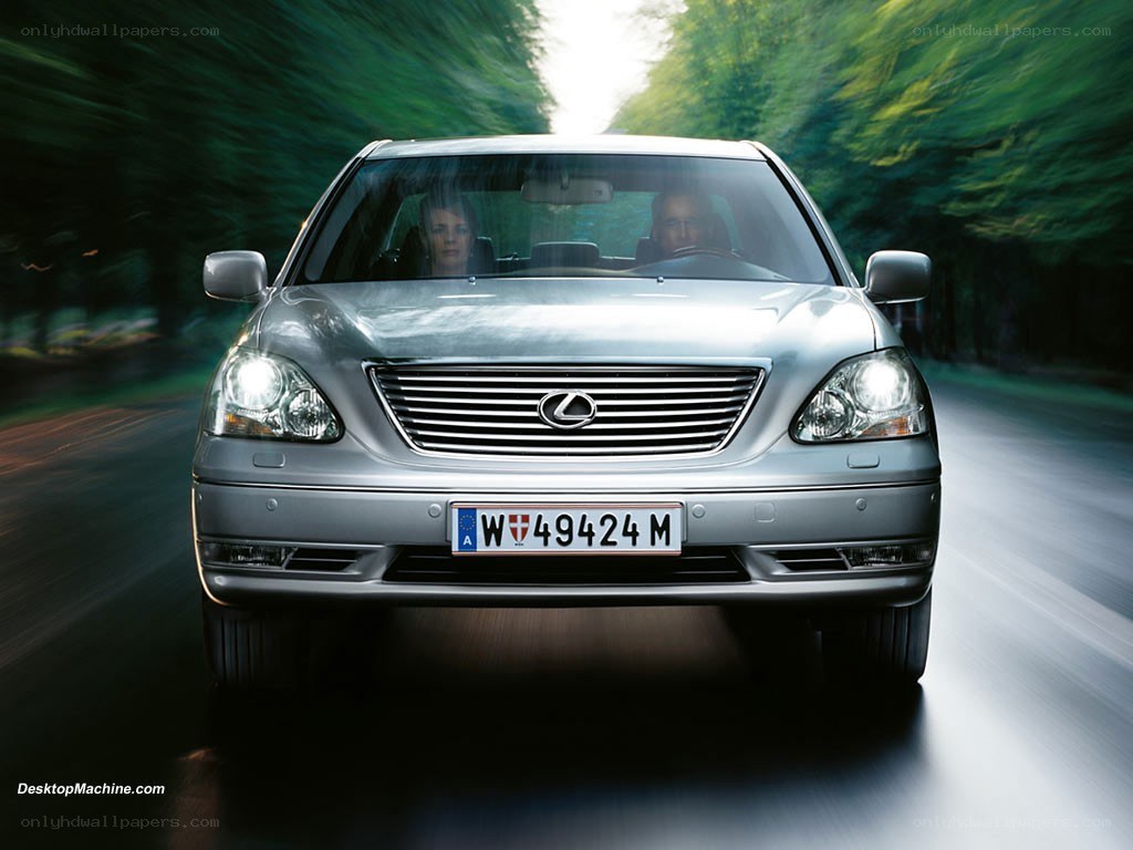 silver lexus driving on road