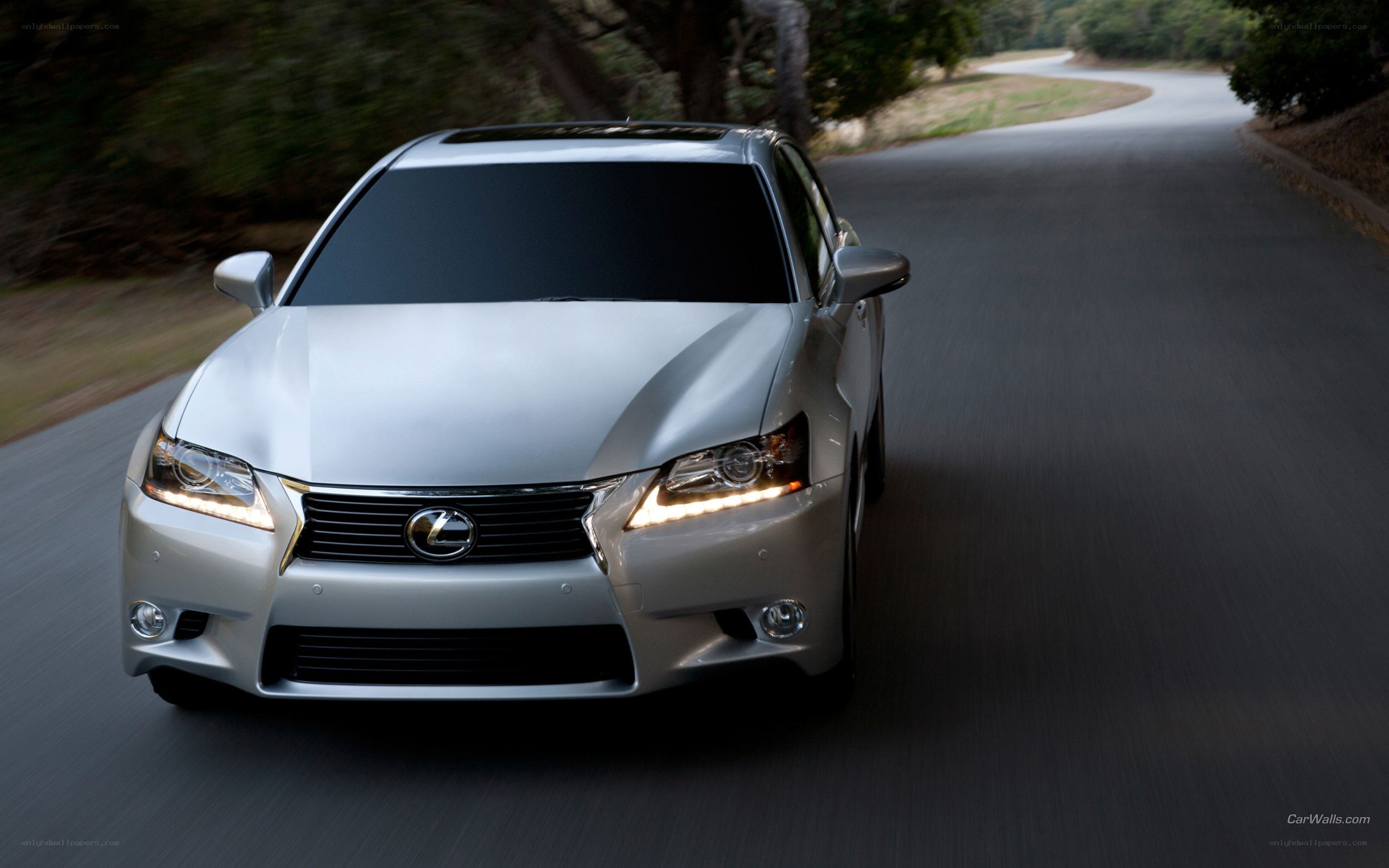 silver lexus driving on road