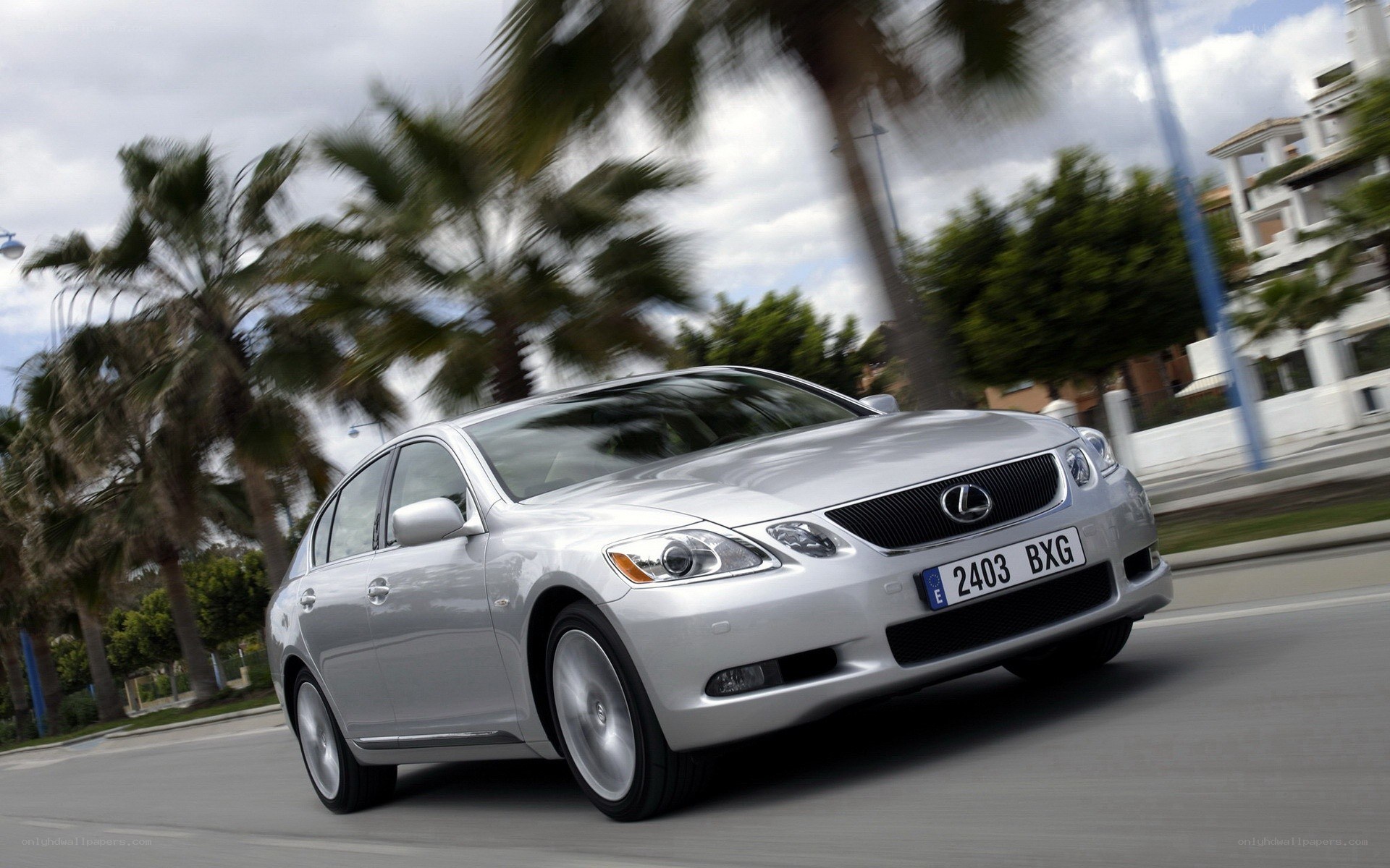 silver lexus driving on road