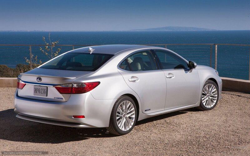 Silver Lexus ES300h by the sea