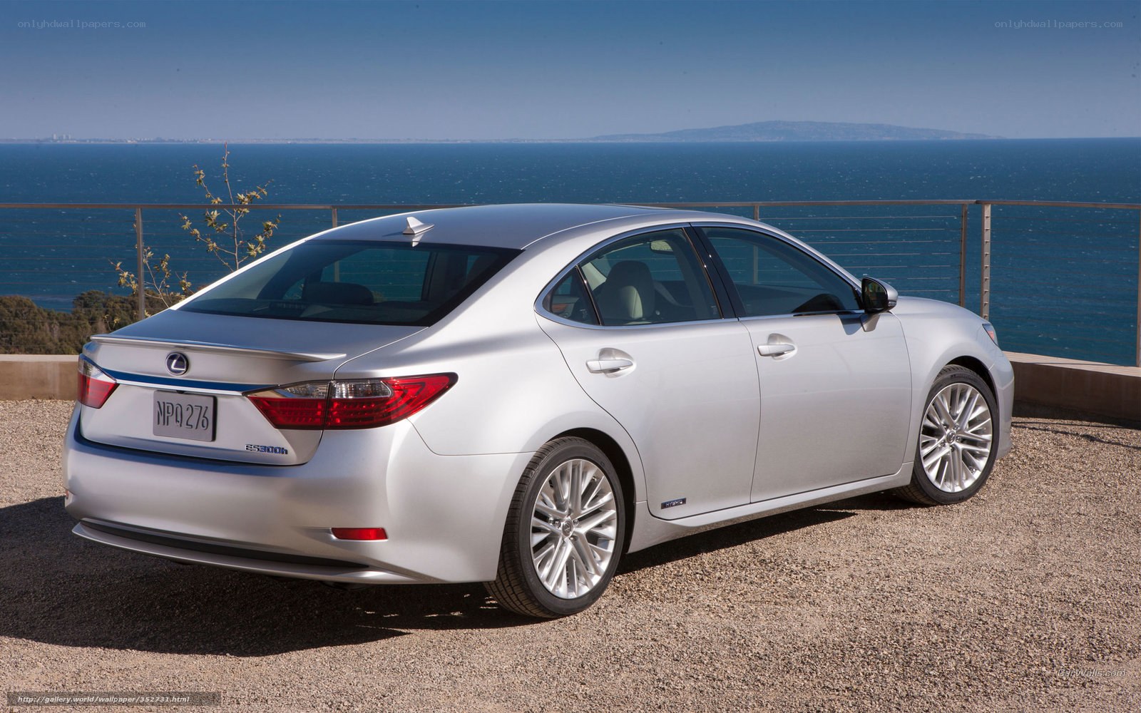Silver Lexus ES300h by the sea