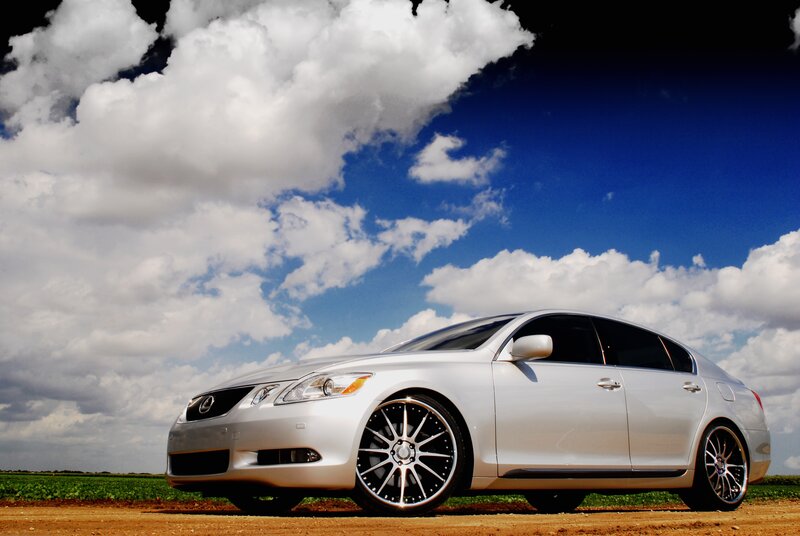 Silver Lexus GS on a dirt road