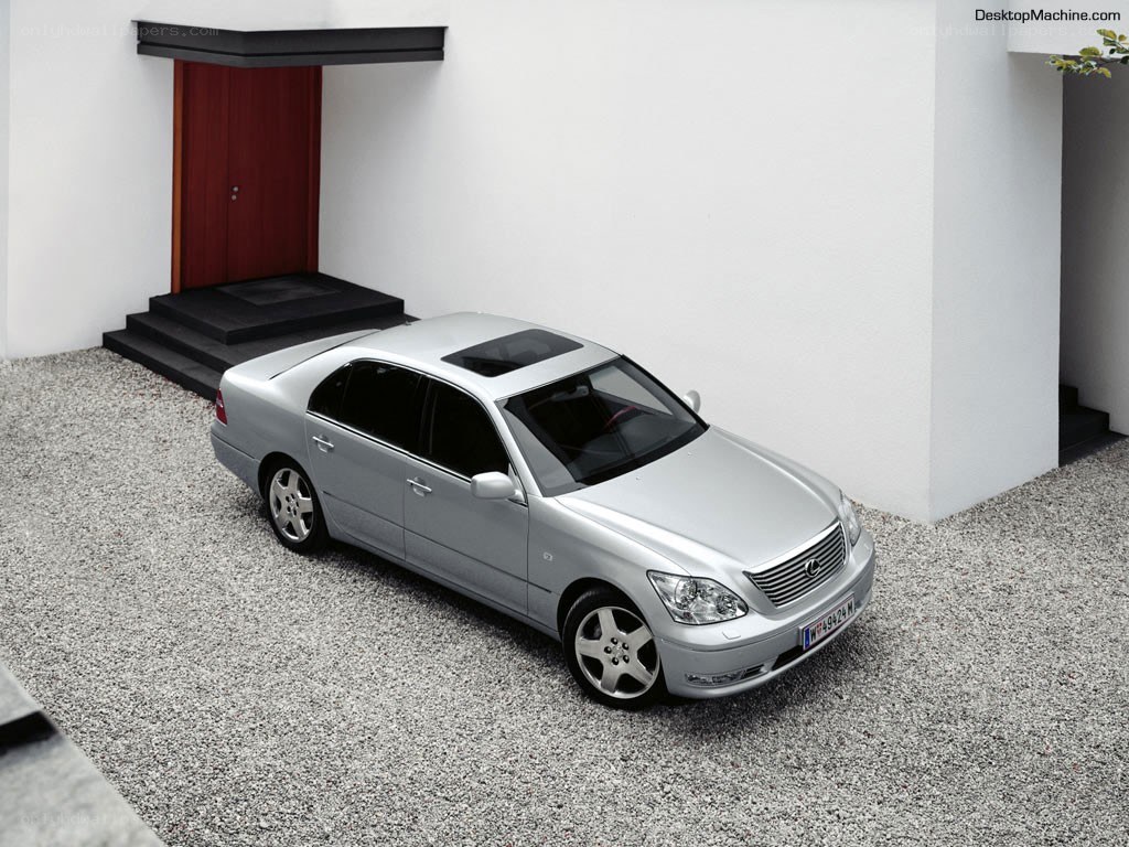 silver lexus in modern driveway