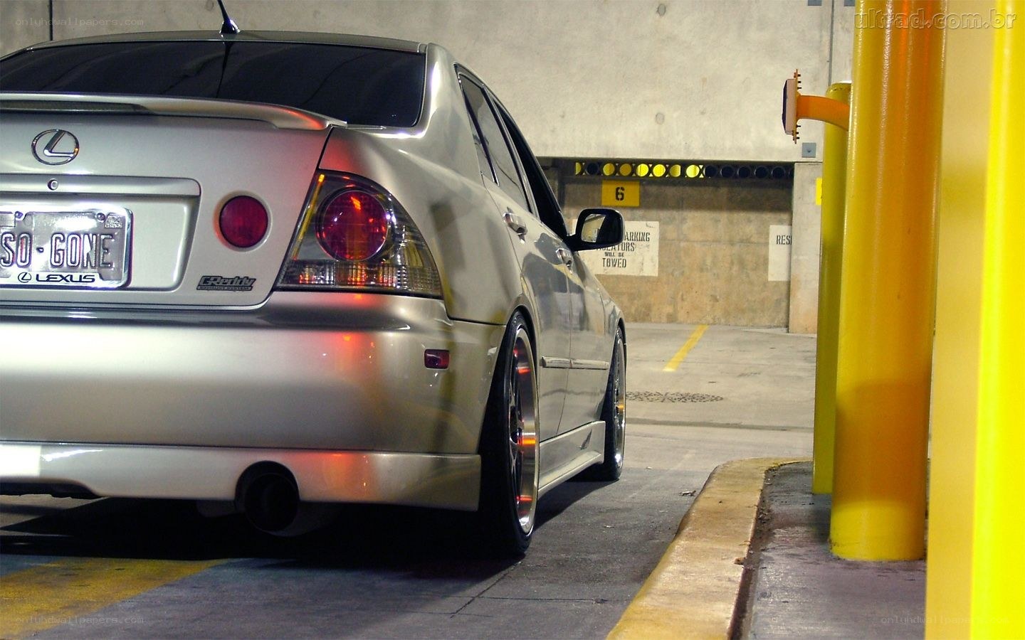 silver lexus in parking garage
