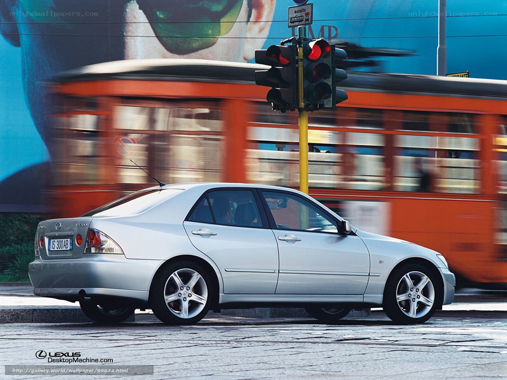 Silver Lexus IS in city traffic