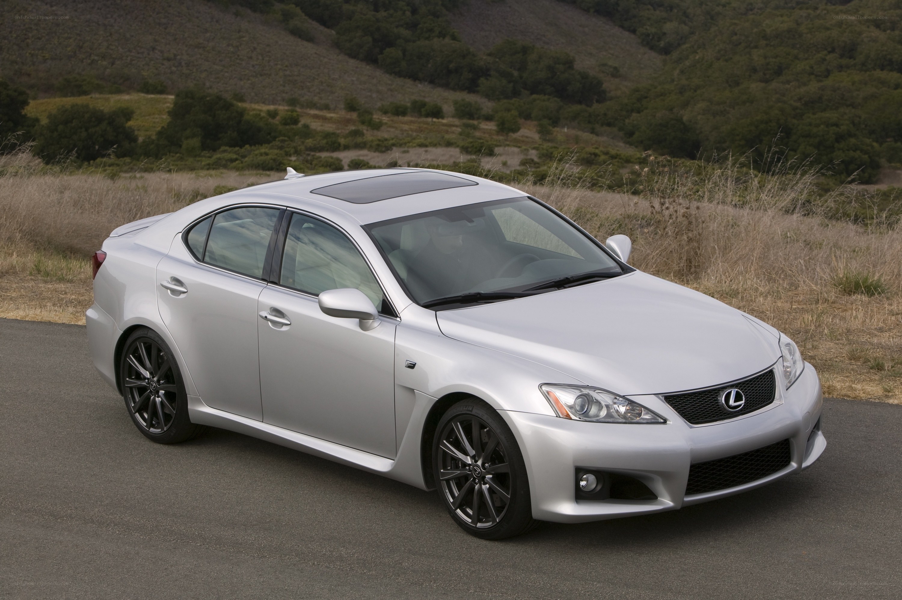 silver lexus is250c on a road