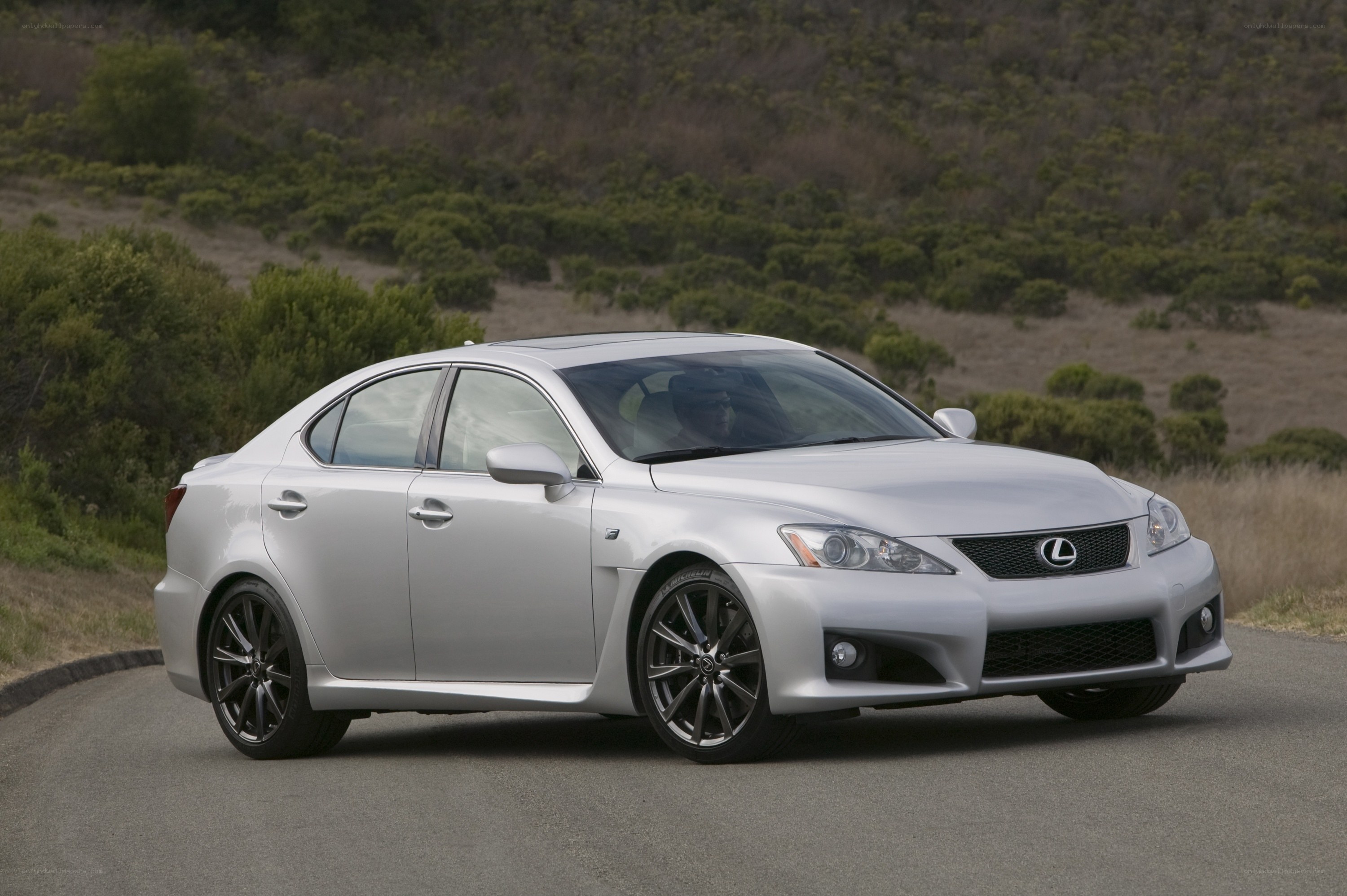 silver lexus is250c on a road