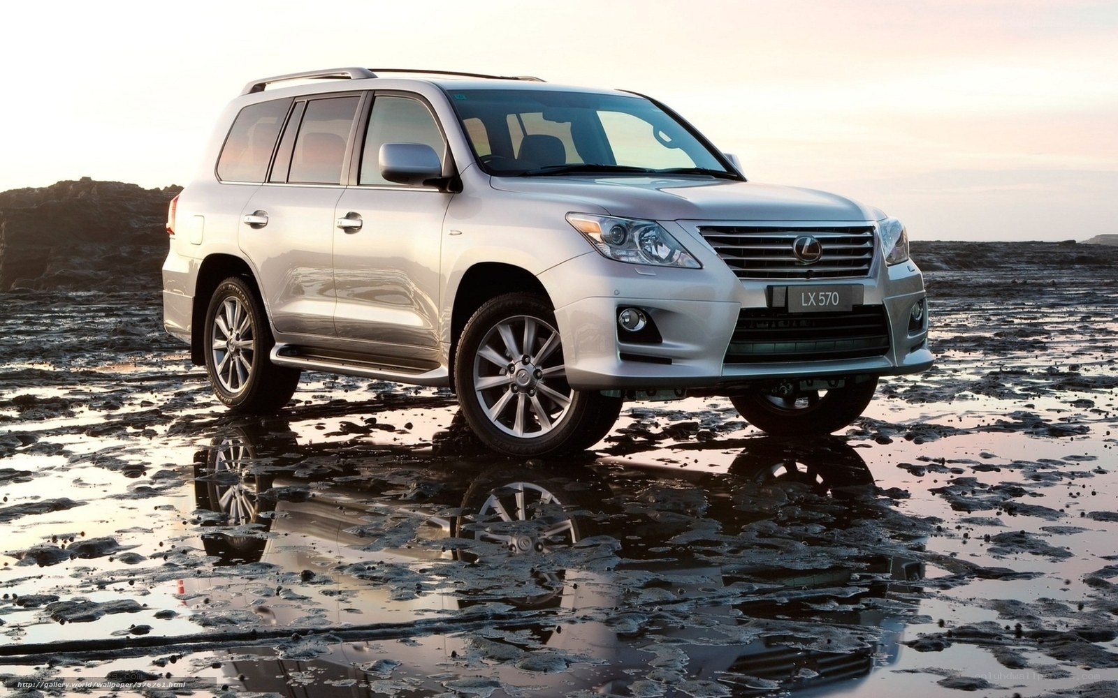 Silver Lexus LX 570 on beach