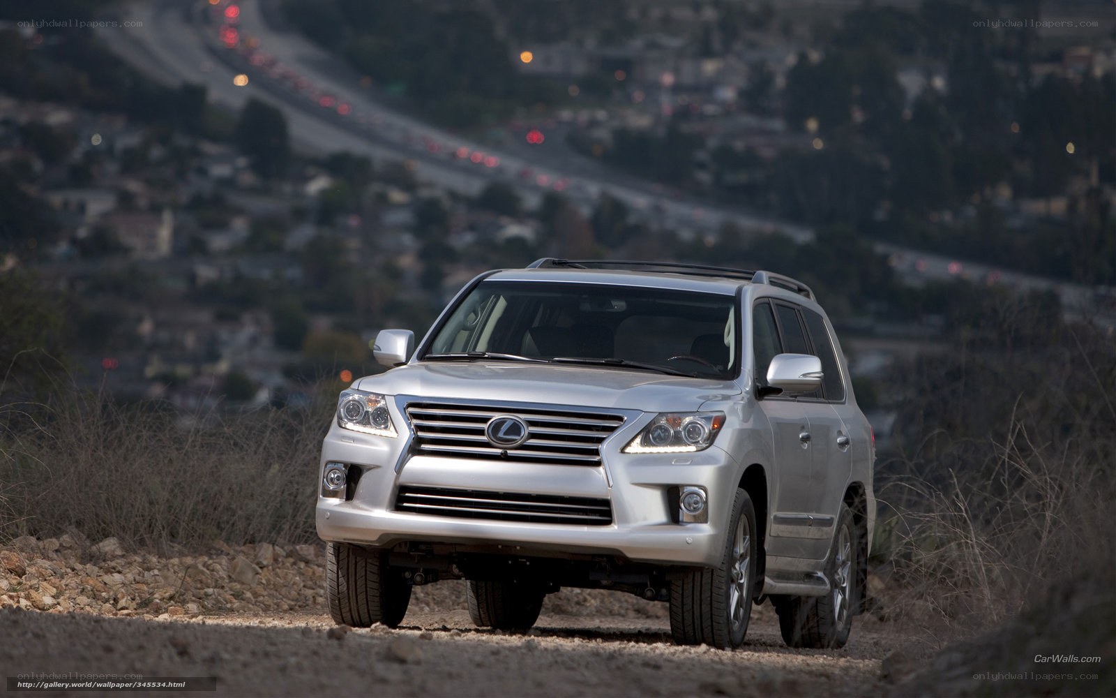 Silver Lexus LX on a dirt road