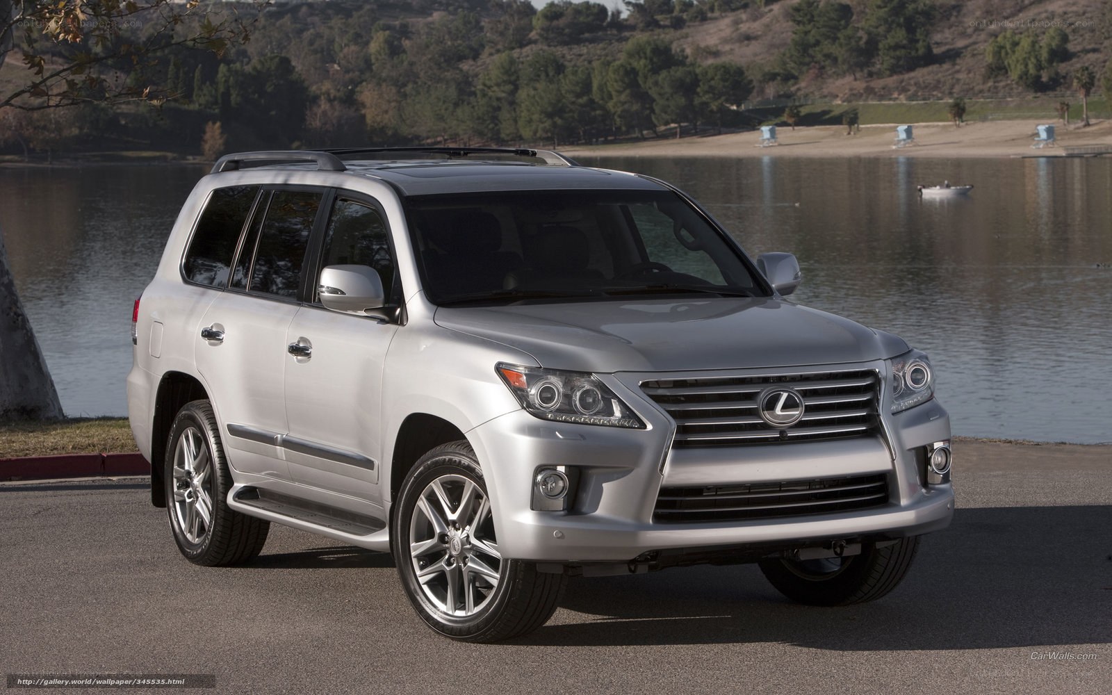 Silver Lexus LX570 by a lake