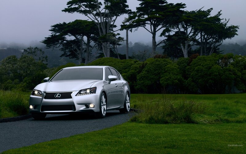 Silver Lexus on a foggy road