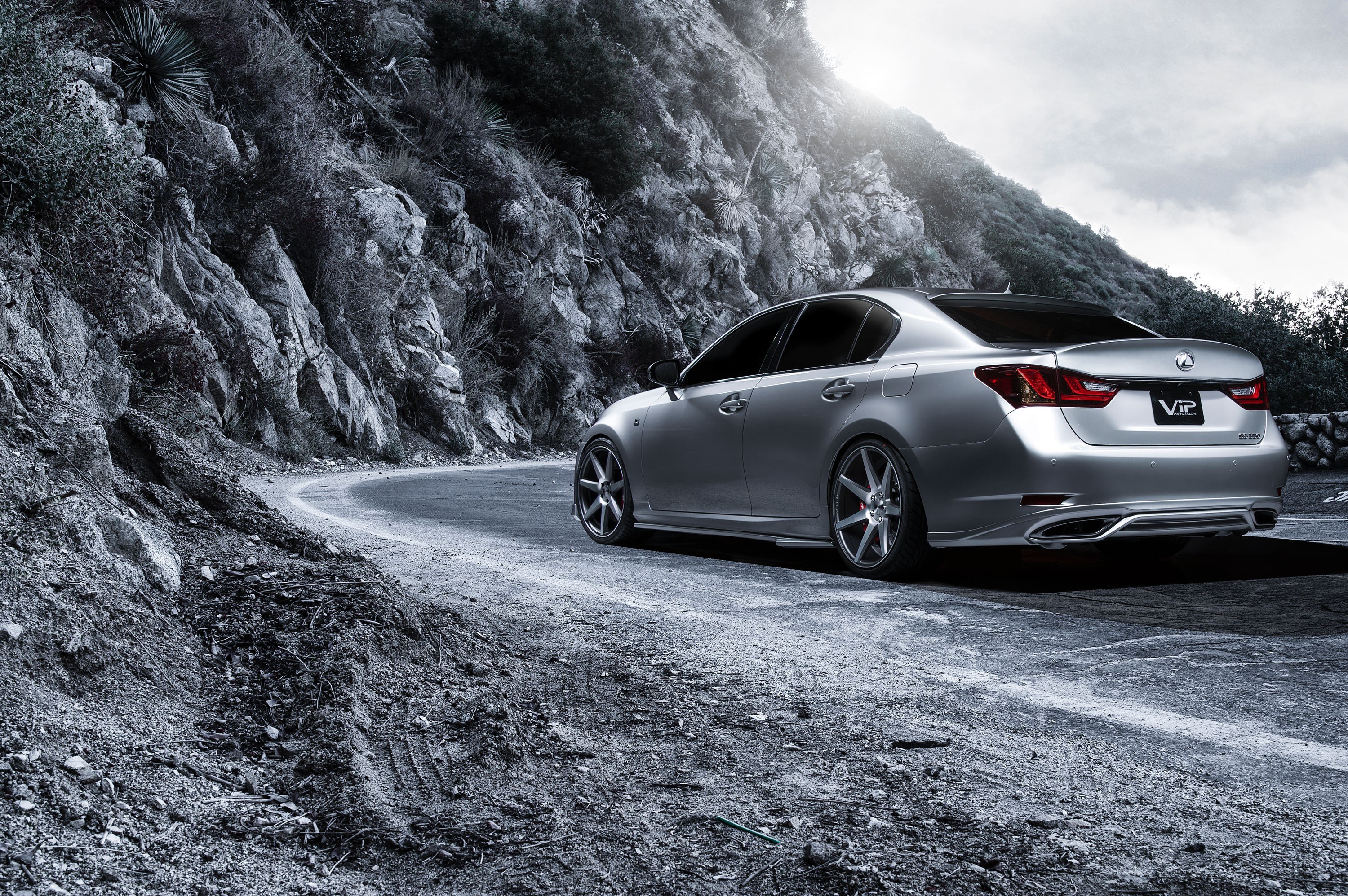 Silver Lexus on a mountain road