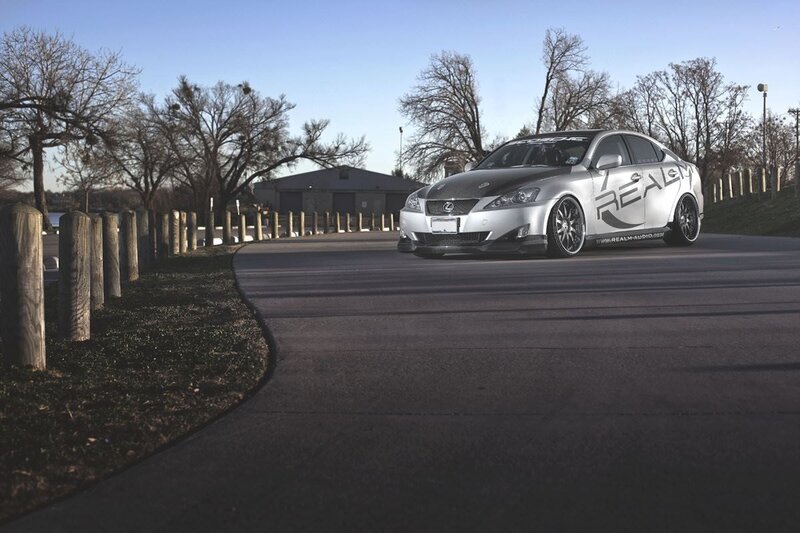 silver lexus on a park road