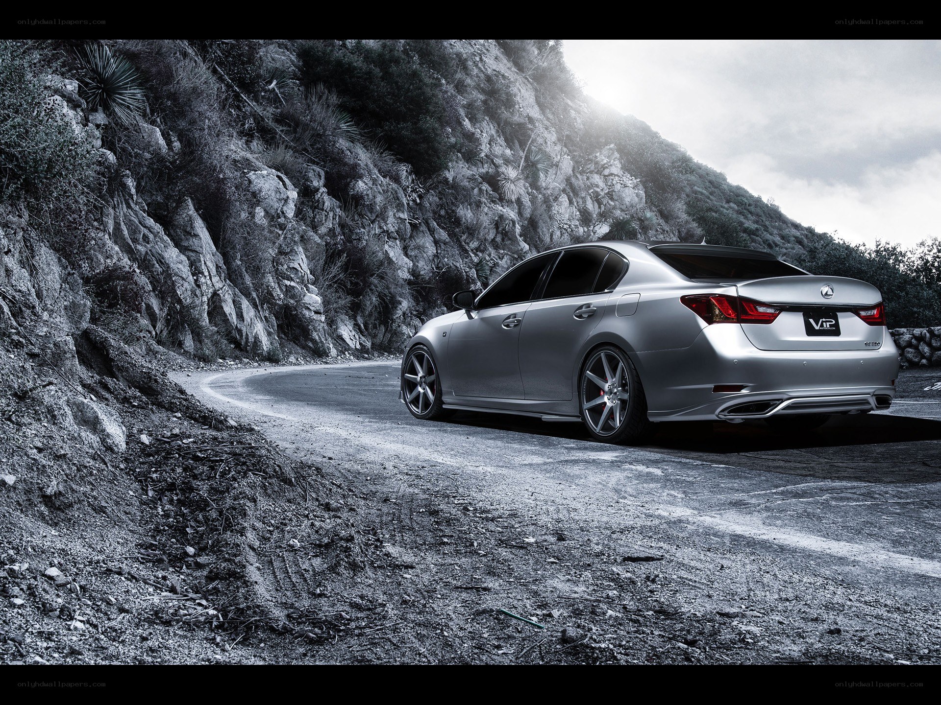 Silver Lexus on mountain road