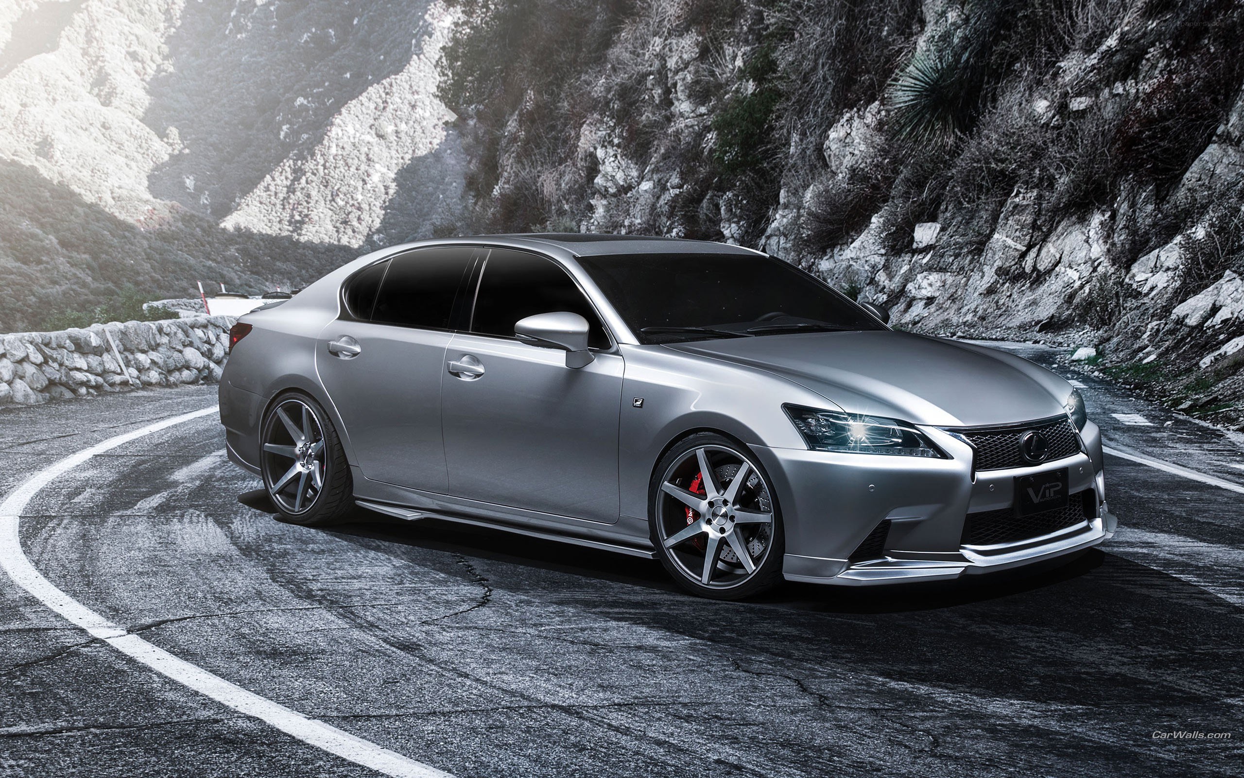 silver lexus on mountain road