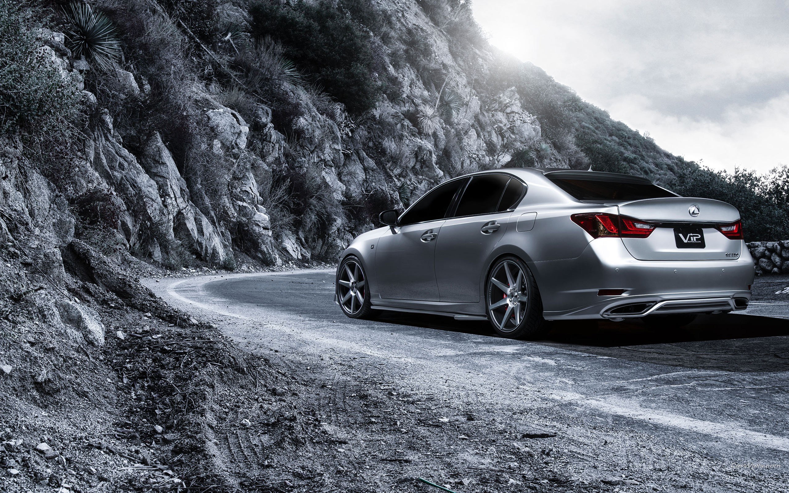 Silver Lexus on mountain road