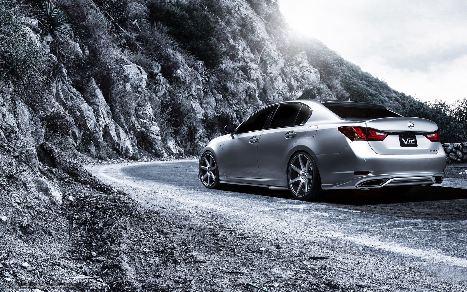 silver lexus on mountain road