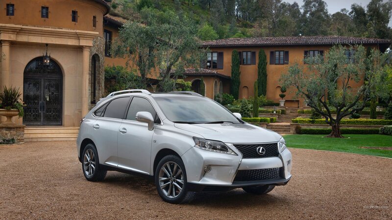 Silver Lexus RX in front of a mansion