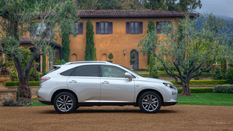 Silver Lexus RX in front of a villa