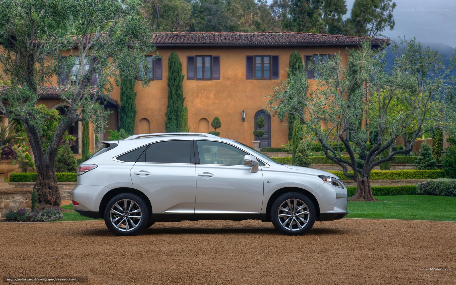 Silver Lexus RX in front of villa