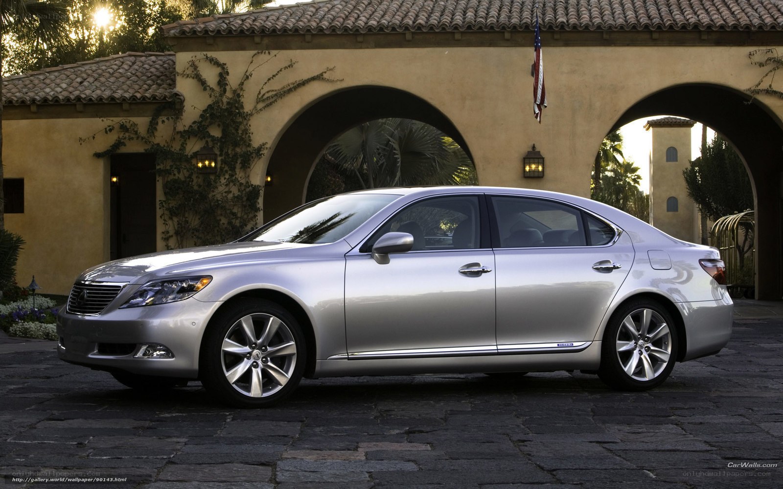 silver lexus sedan in courtyard