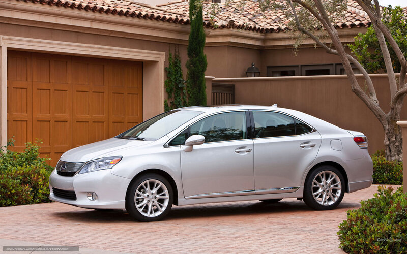 Silver Lexus sedan in driveway