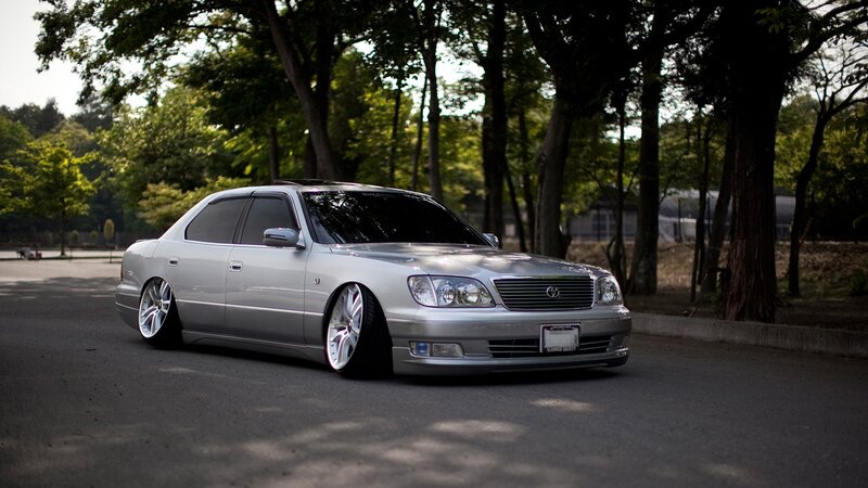 silver lexus sedan in park