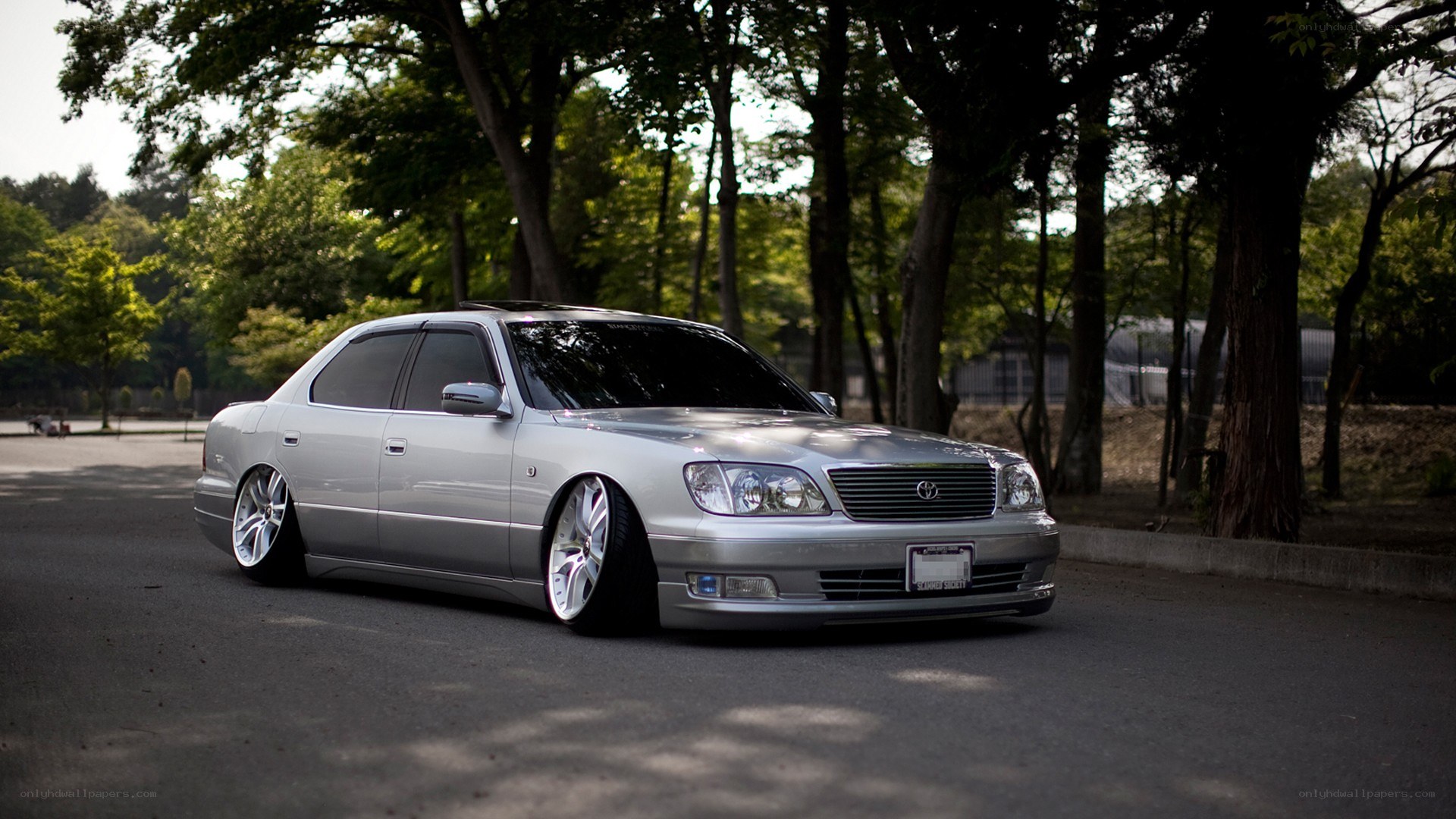 silver lexus sedan in park