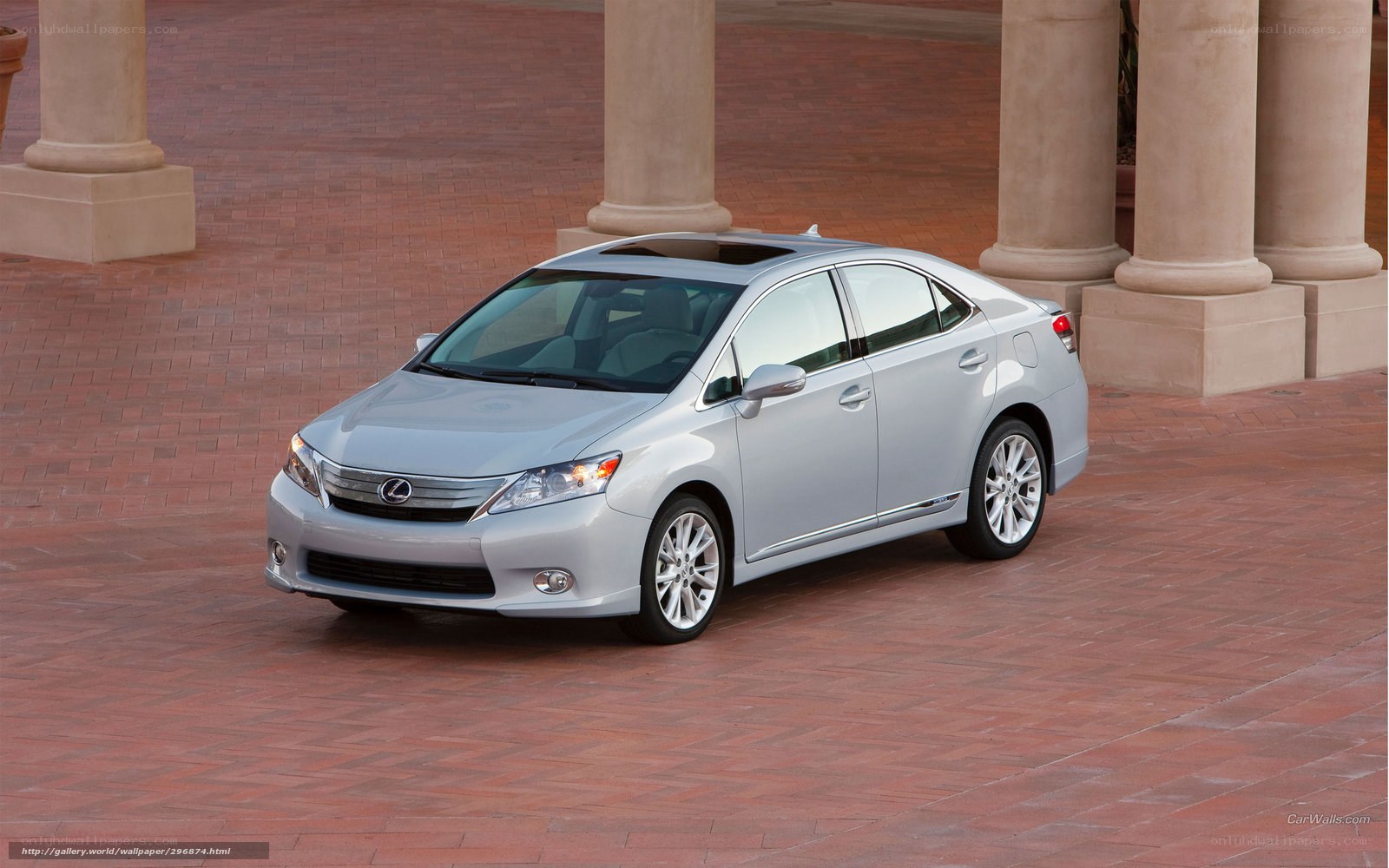 silver lexus sedan on brick pavement