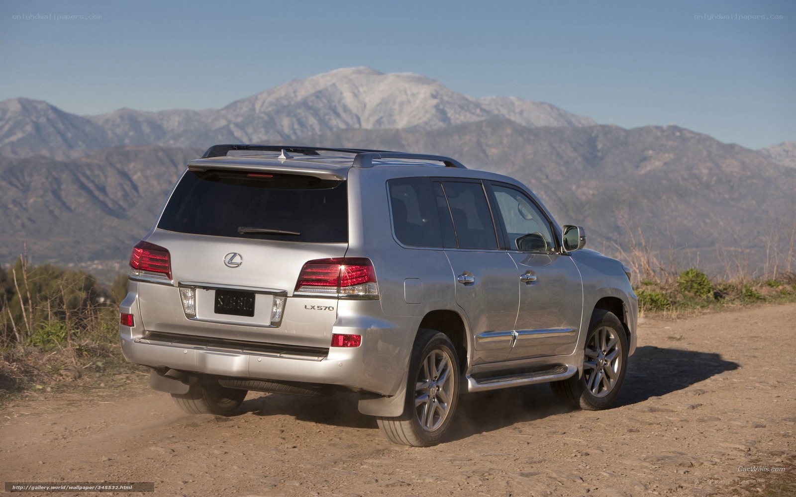 silver lexus suv on dirt road