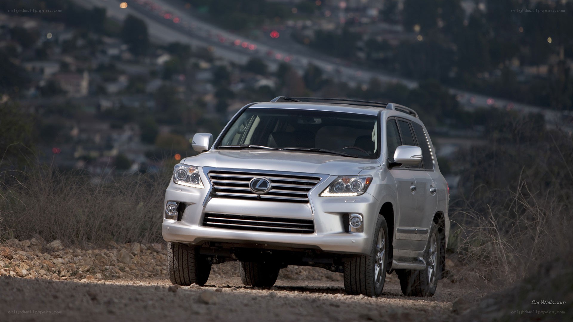 silver lexus suv on dirt road