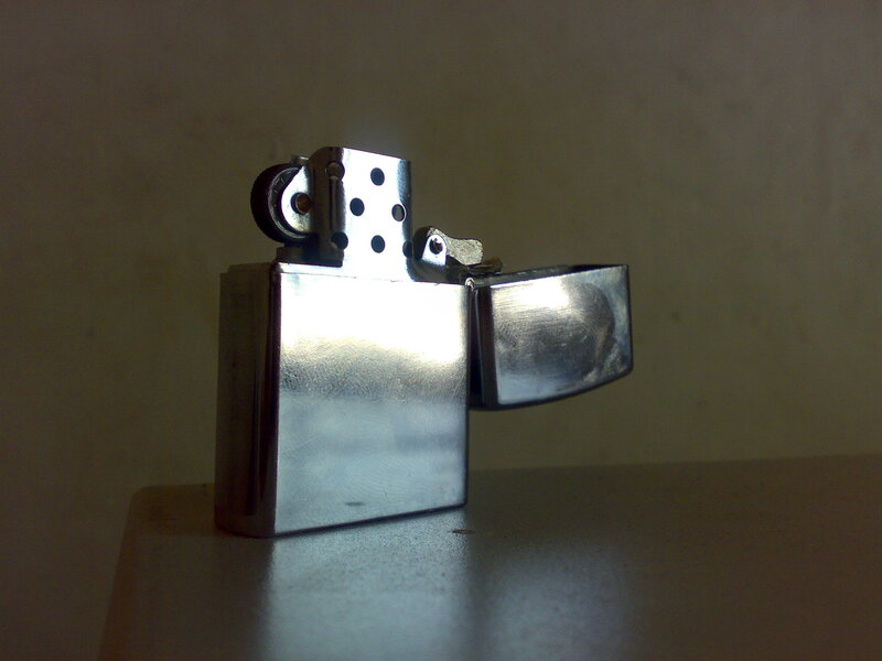 silver lighter on table