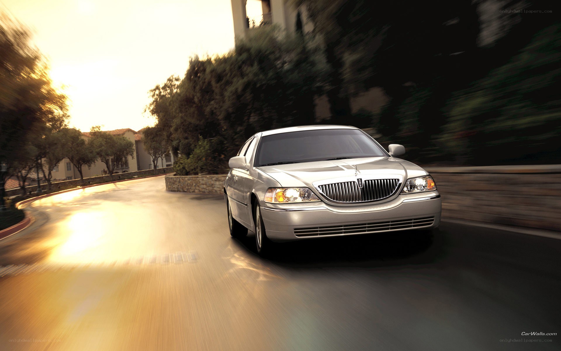 silver lincoln driving on road