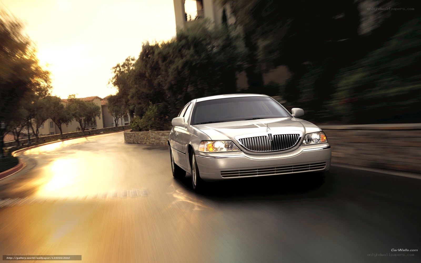 silver lincoln driving on road