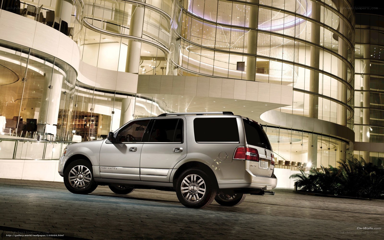 Silver Lincoln Navigator at night